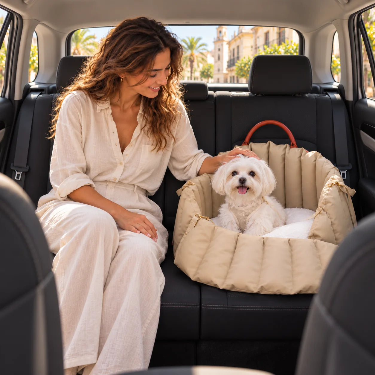 A woman and dog together beside the Cozy Nest in the car